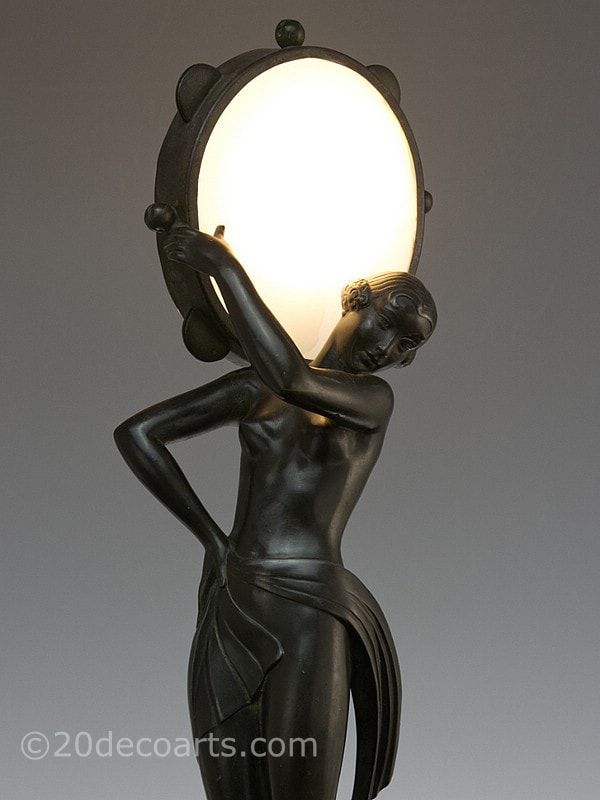 Pierre Le Faguays Farandole  for Max Le Verrier and signed Fayral - An Art Deco metal lamp, France circa 1930, with a dark green bronzed finish