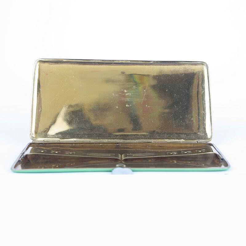  20th Century Decorative Arts | An Art Deco enamelled and gilded metal cigarette case, 1930s decorated in black and green with raised gilded lines.