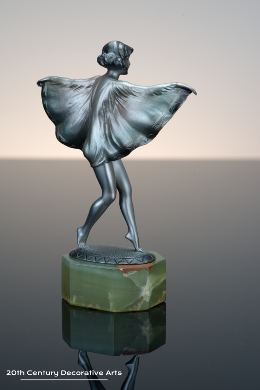   Otto Scheer - An Art Deco bronze figure circa 1930 - depicting a costumed young woman cold-painted silver
