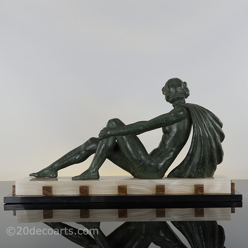  Art Deco spelter figure by Ugo Cipriani, the antiqued green finish stylish figure on a dramatic marble and onyx base 
