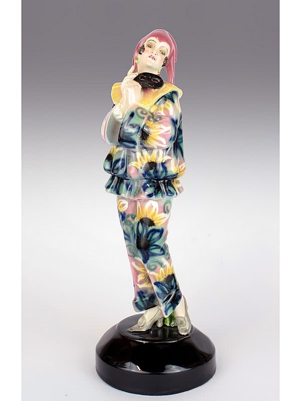 20th Century Decorative Arts |A rare and stylish Art Deco figure by Lorenzl for Goldscheider, "Pierrette mit Maske" Vienna Austria c1925 - depicting a Pierrette in a stylish floral decorated outfit.