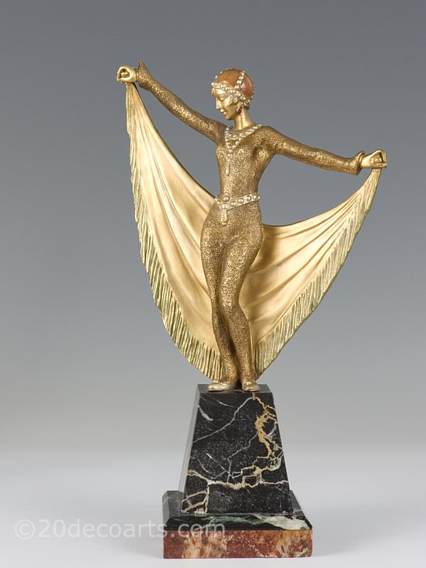  20th Century Decorative Arts |A rare Art Deco French bronze figure by Henri Désiré Grisard, circa 1925 depicting a cat-suited dancer with drape and a gilded and enamelled cold-painted finish, mounted on a shaped multi-marble base.