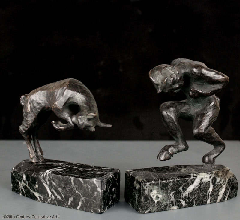  20th Century Decorative Arts |Art Deco bronze sculptural bookends, circa 1920, probably Louis Potet, France the patinated bronzes featuring Pan and goat, mounted on shaped dark green marble bases